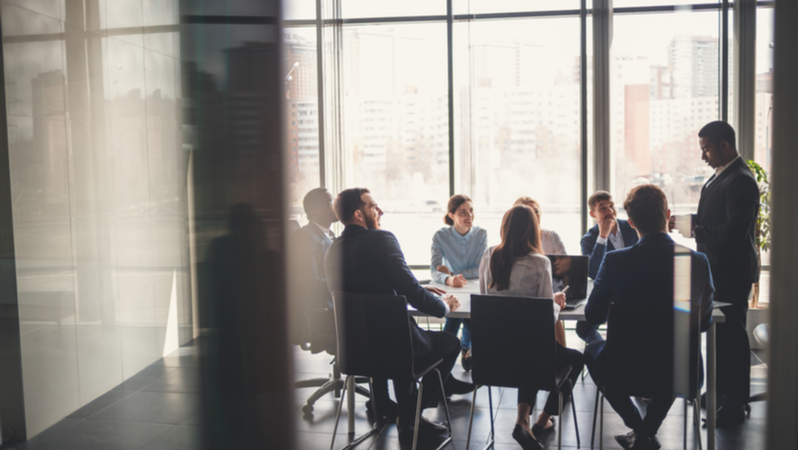 Man in a suit holding business meeting