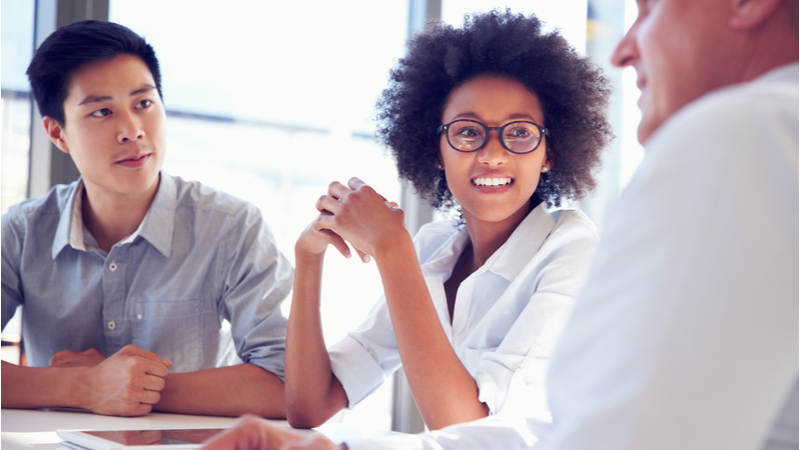 Woman smiling during a business meeting