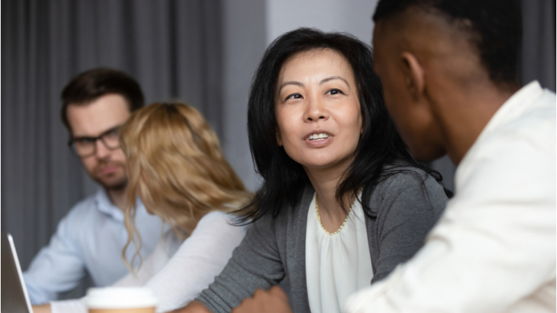 Coworkers discussing business issues in office